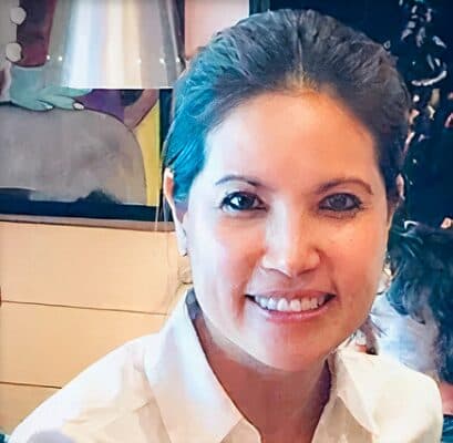 Professional portrait of Dr. Christine Mai smiling, wearing a white collared shirt.